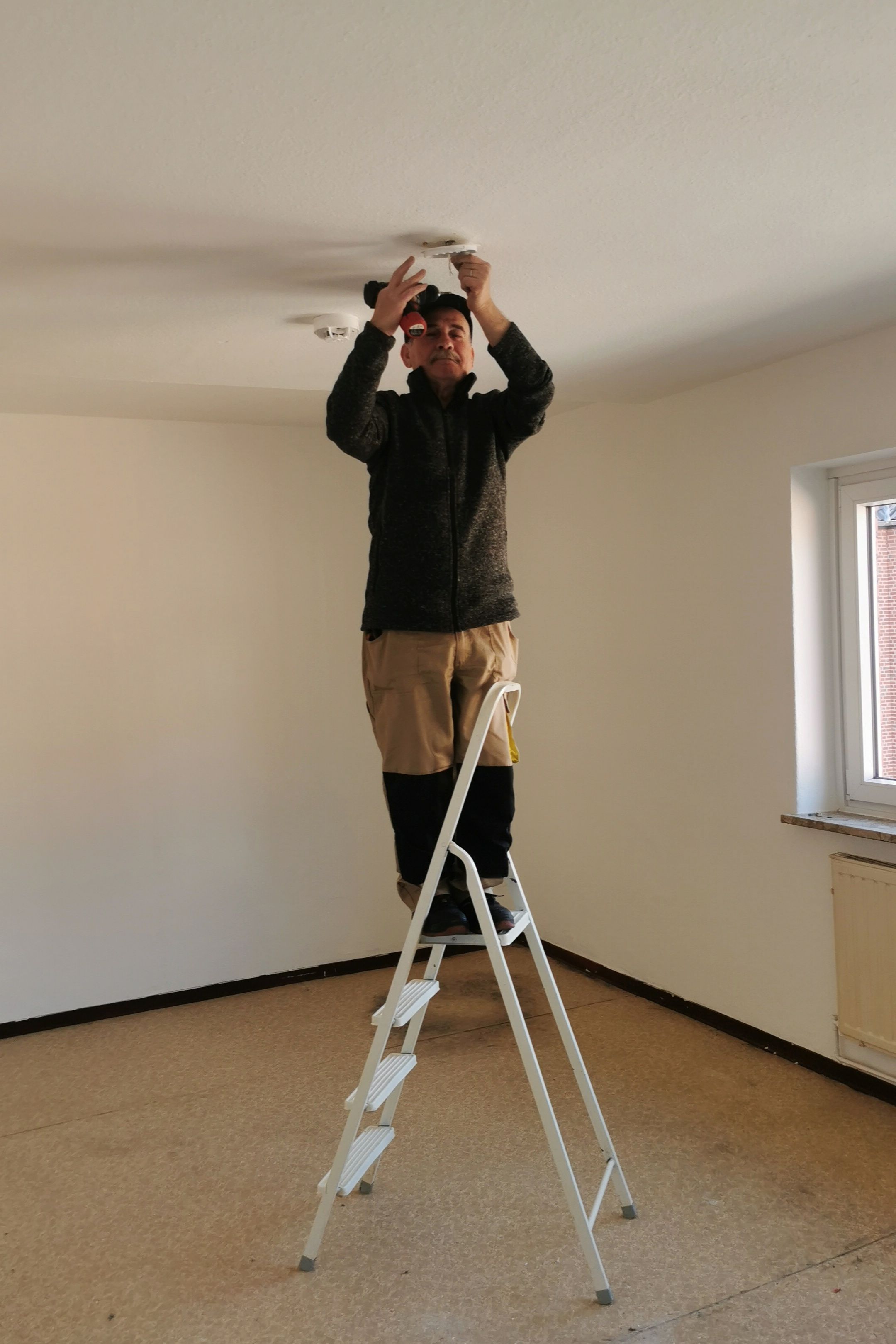 Electrician carrying out electrical installation work